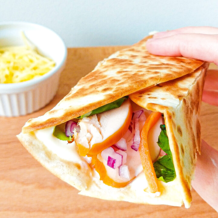 Tortilla wrap with smoked chicken, cheese and homemade sauce