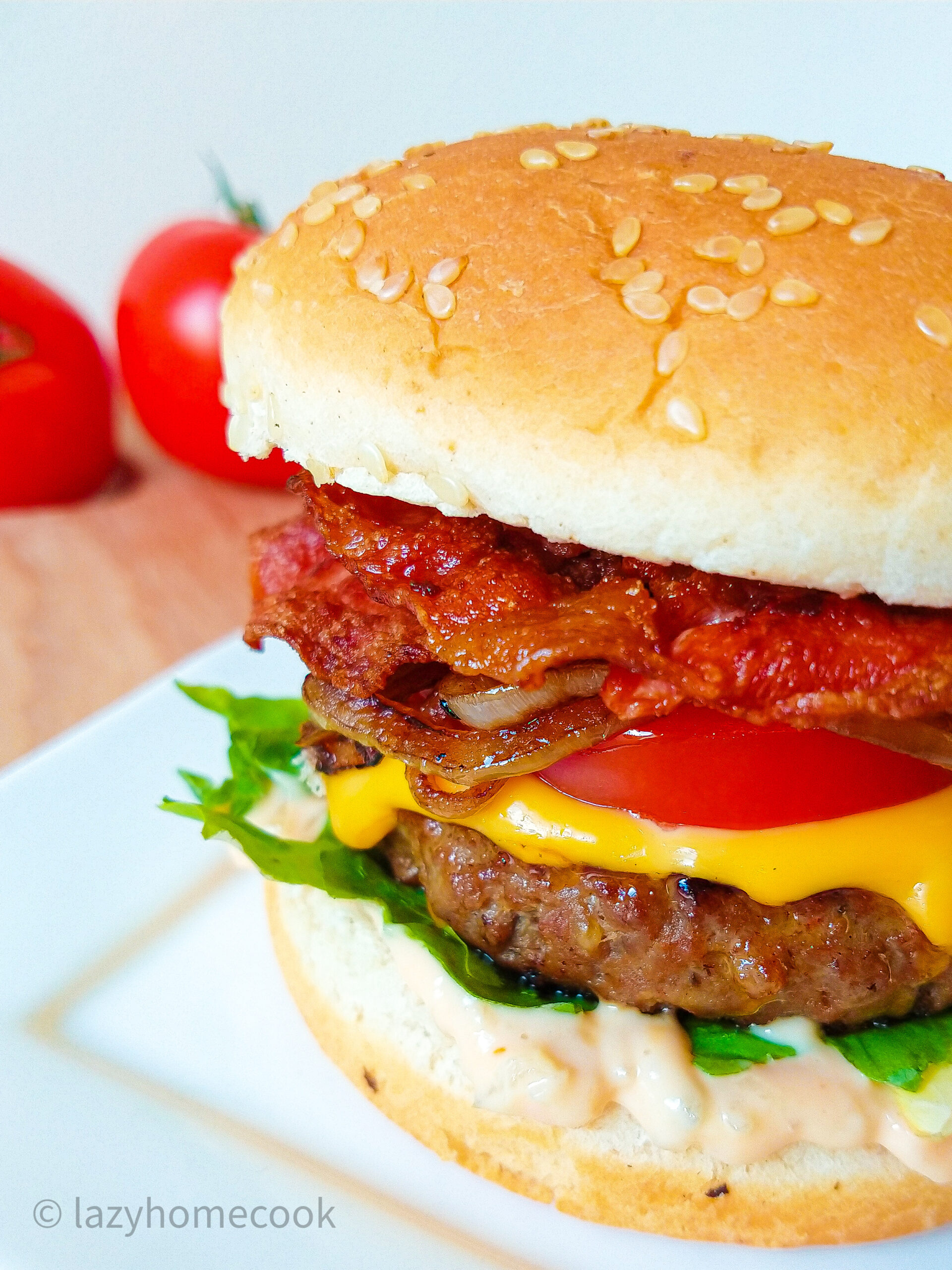 Juicy burger with crispy bacon and homemade sauce
