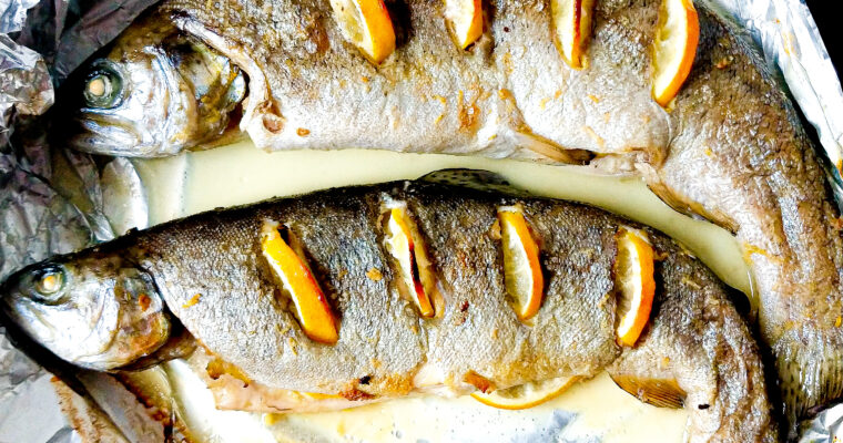 Oven baked whole trout with lemon, ginger and white wine