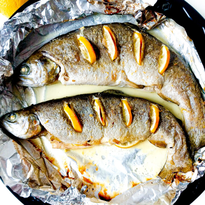 Oven baked whole trout with lemon, ginger and white wine